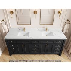 double sink vanity with marble top and gold faucets