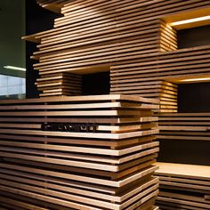 the wooden shelves are stacked high with wood strips on them, making it look like they have been made out of plywood