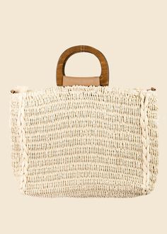 This is a stunning must have tote bag features a gorgeous braided square tote bag design. An excellent choice for Summer or Beach vibes! Fully lined with interior pockets and crossbody option This tote bag approximately measures: Length: 15 Inches Width: 3 Inches Height: 14 Inches Chic Natural Beach Bag With Handles, White Straw Bag With Top Carry Handle For Vacation, Chic Natural Box Bag For Summer, Summer Travel Top Handle Box Bag, Beige Rectangular Bucket Bag With Top Carry Handle, Chic Summer Beach Box Bag, Trendy Beige Box Bag For Beach, Chic Vacation Box Shoulder Bag, Chic Shoulder Box Bag For Vacation