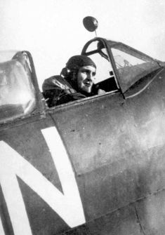 a man sitting in the cockpit of an airplane