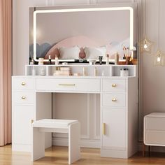 a white dressing table with a lighted mirror and stool in front of it on a wooden floor