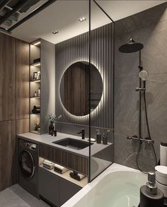 a bathroom with a sink, washer and dryer in front of a mirror