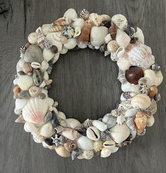 a wreath made out of seashells on a table