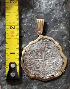 This piece has a beautiful and bold look to it, a large odd shape that gives this coin a lot of character. The coin itself is made from the silver bars recovered from the Atocha and comes with a certificate stating that. I use moulds from the original coins to get the print. This is a replica but actually made from the silver from the Atocha. The frame around is SOLID 14KT GOLD. a large, heavy and beautiful piece of history. Gold Coin Jewelry, Key West Fl, Coin Set, Weird Shapes, Coin Jewelry, Silver Coin, Silver Bars, Gold Gilding, Gold Coins