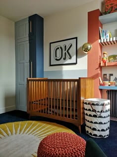 a baby's room with a crib and bookshelf