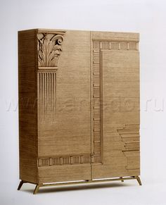 a wooden cabinet with carvings on the front and side panels inlayed to it