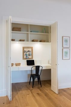 a chair sitting in front of a desk with a laptop on it