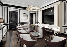 an elegant dining room with black and white walls