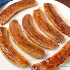 several pieces of sausage on a white plate