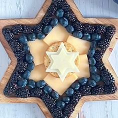 a star shaped tray with blueberries and crackers