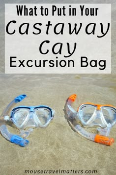 two scuba goggles sitting on the sand with text overlay reading what to put in your castaway cay excursion bag