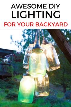 mason jar lights hanging from a tree with the words awesome diy lighting for your backyard