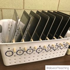 a white container filled with lots of different types of kitchen utensils