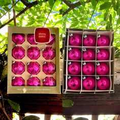 two boxes filled with pink ornaments sitting next to each other