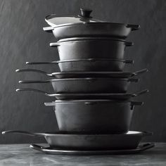 a stack of pots and pans sitting on top of each other