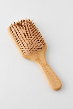 Designed to glide through your hair smoothly, while teasing natural oils along each strand, this Emi Jay brush helps give your hair a nourished and shiny look and feel. Features Paddle brush from Emi Jay Ventilation hole to aid in drainage after the brush has been washed Content + Care Organic bamboo wood handle, bristles, bio-acetate back Imported Size Dimensions: 9.8" l x 3.3" w | Emi Jay Bamboo Paddle Brush in Pink at Urban Outfitters Wood Hair Brush, Cute Hairbrush, Emi Jay, Bamboo Brush, Paddle Brush, Brand Sale, Hair A, Hair Brush, Art Project