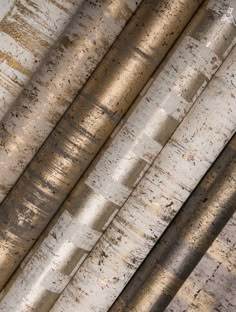 an overhead view of metal pipes with rusted paint on them and the top one is yellow