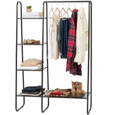 an iron rack with clothes hanging on it and two shelves holding shoes, sweaters and pants