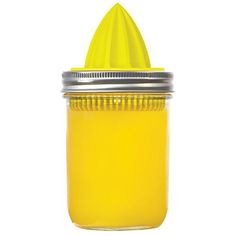 a yellow mason jar filled with liquid on a white background