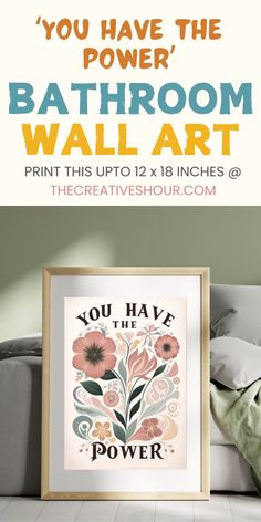 the bathroom wall art print is displayed in front of a bed with pillows and blankets