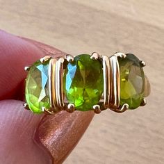 Great Vintage Find, Bright Apple Green Peridot In Delicious Vibrant Green Color ! The Ring Is A Size 6.75 On Ring Mandrel, Weights 2.51 Grams. Very Versatile Triple Stone Design , Each Oval Peridot Stone Is Approx.6mm Long By 4mm Wide. The Ring Is Very Pretty, Well And Sturdy Done, Perfect For Spring And Summer Outfits ! Spring And Summer Outfits, Ring Mandrel, Gold Apple, Three Stone Ring, Peridot Stone, Green Peridot, Stone Design, Apple Green, Vibrant Green