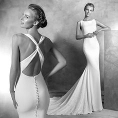 a woman in a white dress standing next to another woman wearing a black and white gown