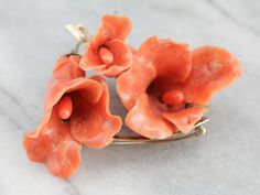 This is a stunning and large intricately and beautifully carved brooch or pendant! With wonderfully polished, textured gold branches and leaves, and beautiful undyed natural coral! The coral is amazingly carved in the shapes of lily blossoms, giving it an amazing three-dimensional quality! This really is a superb and high-quality piece, hand-made of beautiful materials and stunning attention to detail! It's in fabulous condition as well! Metal: 14K Yellow Gold Gem: Carved Coral Gem Measurements: Peach Dresses, Fine Jewlery, Gold Branches, Angel Skin, Coral Pendant, Gold Pin, Antique Brooches, Natural Coral, Coral Earrings