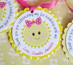 three personalized birthday tags with bows on them