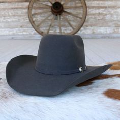 Introducing the Resistol 90 Pay Window Grey Cowboy Hat, designed for those who appreciate both function and style. It features a bold 5 1/4" round brick crown and a 4 1/4" brim, offering a classic yet distinctive silhouette. The silver buckle hatband set adds a touch of elegance, making it a statement piece for any occasion. Whether you're in the saddle or out on the town, the Resistol Pay Window blends timeless Western tradition with modern craftsmanship. Brims: 4 1/4" Crown: 5 1/4" Wool Grey Cowboy Hat, Felt Cowboy Hat, Felt Cowboy Hats, Hat Types, Felt Hat, Hat Band, Cowboy Hat, Christmas List, Oval Shape