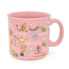 a pink coffee mug with pictures of animals and other things on the inside of it