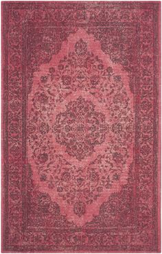 a red rug with an ornate design on it