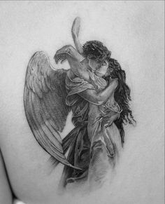 a woman with an angel tattoo on her back