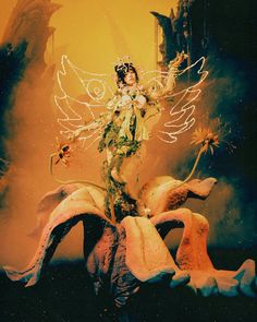 a woman dressed as a fairy standing on top of a giant banana with flowers in her hands