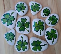 shamrocks painted on rocks are arranged in a circle