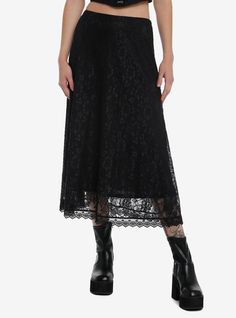 We're giving witchy vibes all summer! This black midi skirt features a lace overlay with an allover floral design. Comes with an elasticated waistband.95% nylon; 5% spandexWash cold; dry lowStretchy materialLength: 32''ImportedListed in junior sizesModel is 5'10''Model wears size Small Witch Skirts, Lace Flowy Skirt For Night Out, Black Lace Skirt For Summer, Lace Long Skirt For Night Out, Black Lace Skirt For Spring, Maxi Black Skirt, Witchy Skirts, Black Lace Skirt For Night Out, Black Skirt With Lace Trim For Spring