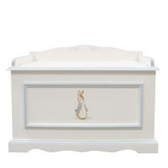 a white chest with a rabbit painted on the front and bottom, sitting against a white background