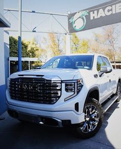 a white truck parked in front of a building