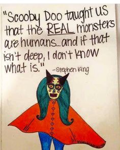 a sign with an image of a cat wearing a cape and saying, scooby doo taught us that the real monsters are humans