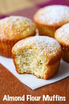 three muffins on a napkin with the words almond flour muffins