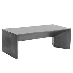 a concrete table sitting on top of a white floor