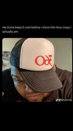 a man wearing a hat with the word omen on it, and an image of him