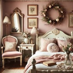 a bedroom decorated in pink and white with pictures on the wall above the bed, along with a wreath