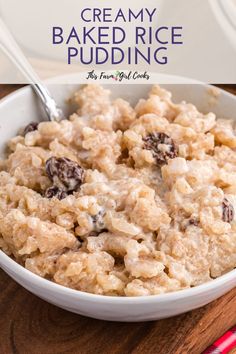 a bowl filled with oatmeal and raisins on top of a wooden table