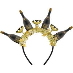 Top off your New Year's look with this black and gold headband. The whimsical hair accessory is topped with plastic champagne bottles gold champagne glasses and gold tinsel with star details. Time to Party Champagne Bottle & Glass New Year's Eve Foil & Plastic Headband product details:  8in tall Fabric-covered headband Plastic and foil One size fits most teens and adults Nye Hats, Gold Champagne Glasses, Gold Champagne Bottle, Whimsical Hair, New Years Hat, Party Champagne, Festival Headpiece, Champagne Party, Diy Balloon Decorations