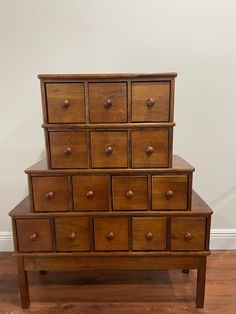 an old wooden dresser sitting on top of a hard wood floor