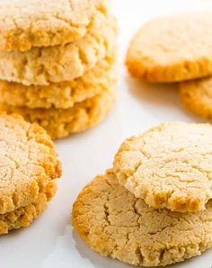 several peanut butter cookies stacked on top of each other with one broken in the middle