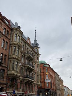 several buildings line the street in front of a traffic light