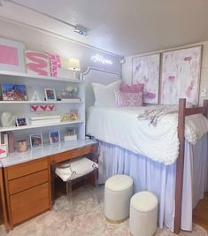 a bed room with a neatly made bed next to a desk and shelves on the wall