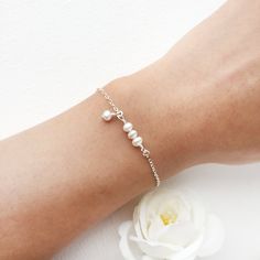 💜 Dainty Pearl Bracelet with Dangle Pearl Charm ✨ Perfect for Bridal Jewelry, Bridesmaids Gift, Birthday Gift Ideas • Handmade with genuine white Freshwater Pearls. All metal parts are high-quality sterling silver, 14K Gold Filled or Rose Gold Filled. • Pearl size: 4 mm • Every bracelet comes with a 0.5-inch extension ✨ To find your bracelet size, measure your wrist and add 0.5 - 1 inch for a room to wiggle (depending on your personal preference) • Hypoallergenic. You won’t have to worry about Birthday Gift Ideas Handmade, Dainty Pearl Bracelet, Bridesmaid Pearl Bracelet, Tiny Pearl Necklace, Gift Ideas Handmade, Silver Pearl Bracelet, Bracelet Packaging, Gold Pearl Ring, Bridesmaid Pearls