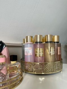 several different types of perfumes sitting on a counter